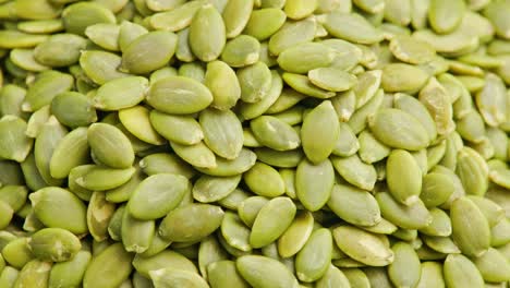 peeled pumpkin seeds full-frame spinning background