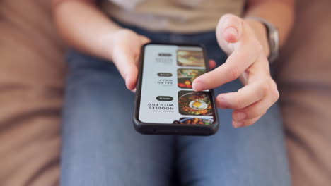 person using food delivery app on smartphone