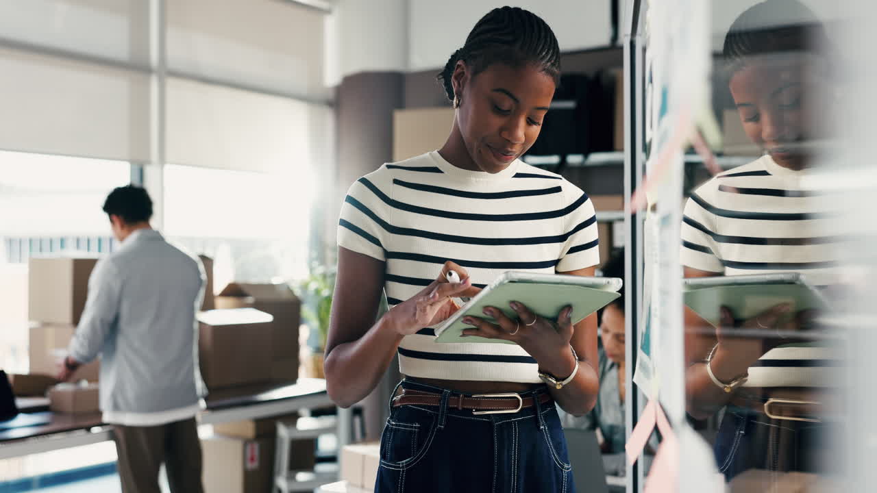 Young Black Woman Managing Online Orders with Tablet