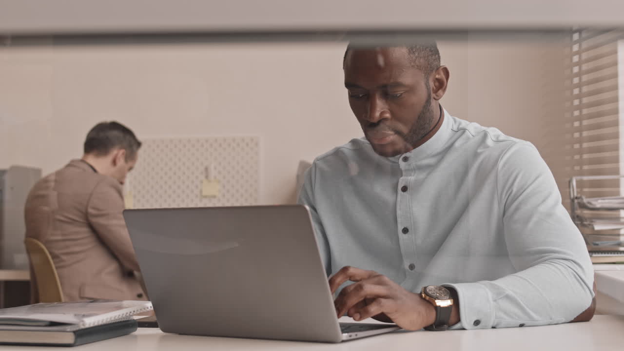 African Man Working on Computer