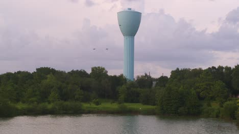 iconic light blue water tower over brays bayou in southwest houston – drone shot