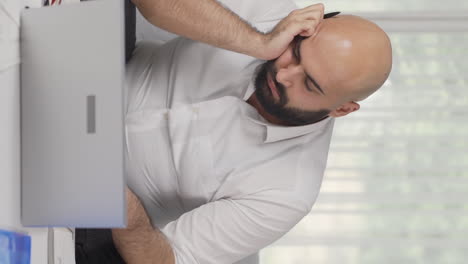 vertical video of home office worker man falling asleep.