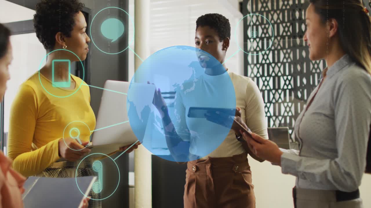 Animation of globe with icons over diverse business people talking in office