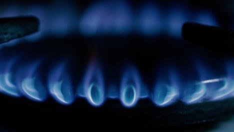 details with a burning match lightning up an old traditional gas stove.