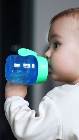 baby drinking from sippy cup