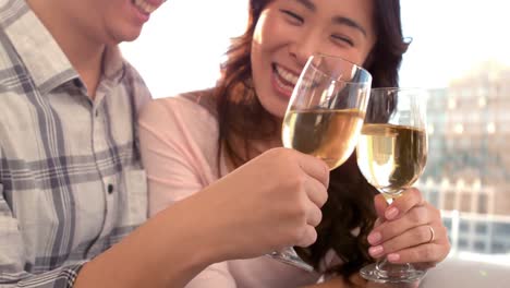 asian happy couple drinking wine