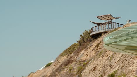 Amazing-view-balcony-between-the-bold-nature-and-green-trees-towards-the-sea-and-sand