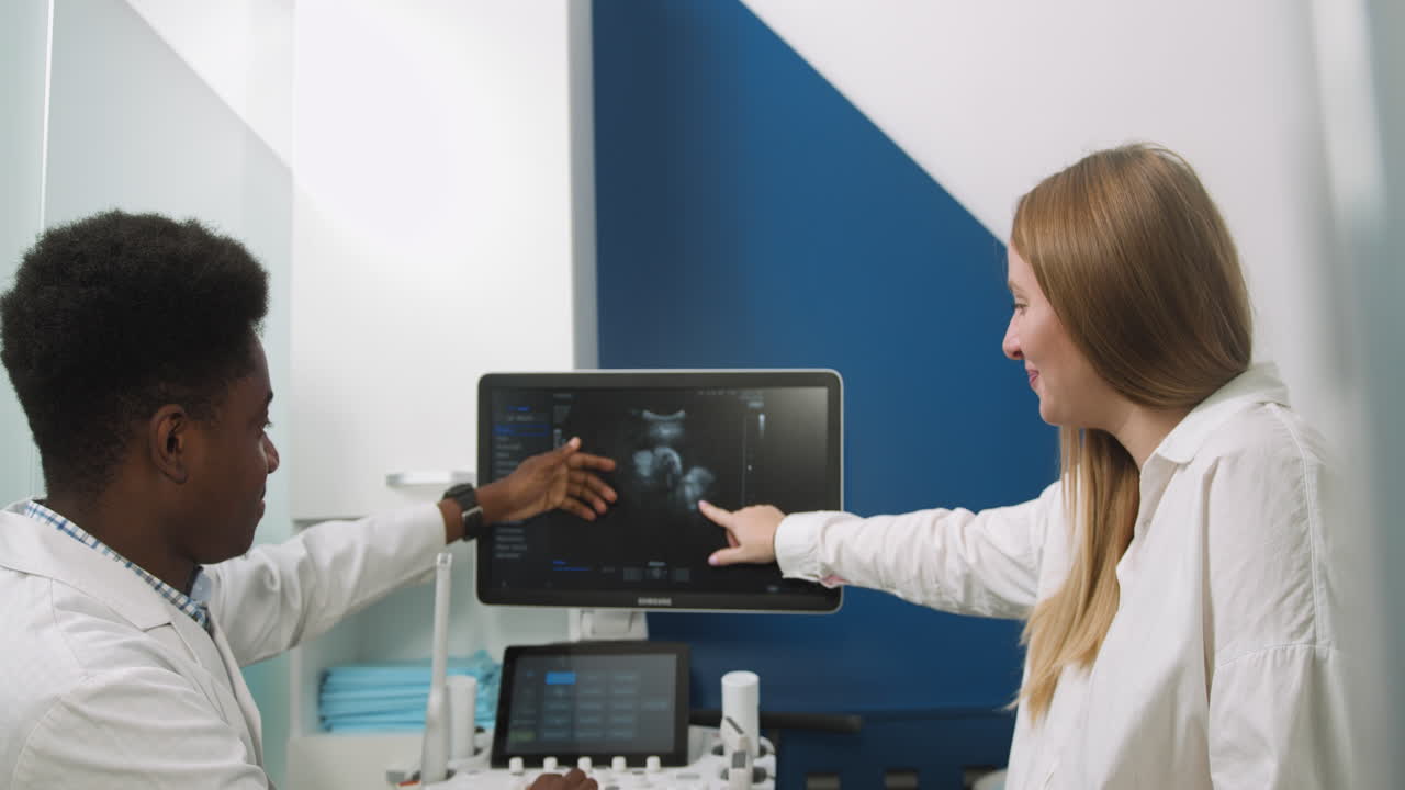 Doctor explaining Ultrasound results to patient.