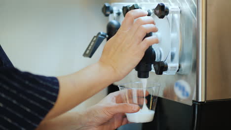 Woman-Pours-A-Drink-Based-On-Ice-And-Wine-Into-A-Glass---Slash