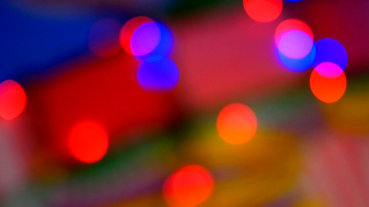 luces de colores borrosos. rojo, verde, amarillo, naranja, azul desenfocado bokeh brillante fondo festivo.