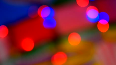 blurred colorful lights. red, green, yellow, orange, blue defocused glittering bokeh festive background.