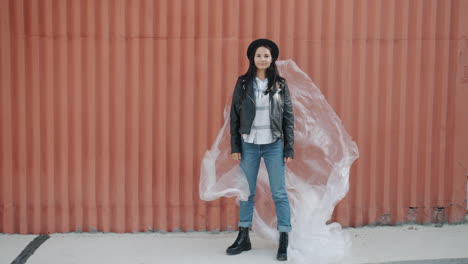 woman in fashionable street style with plastic sheet