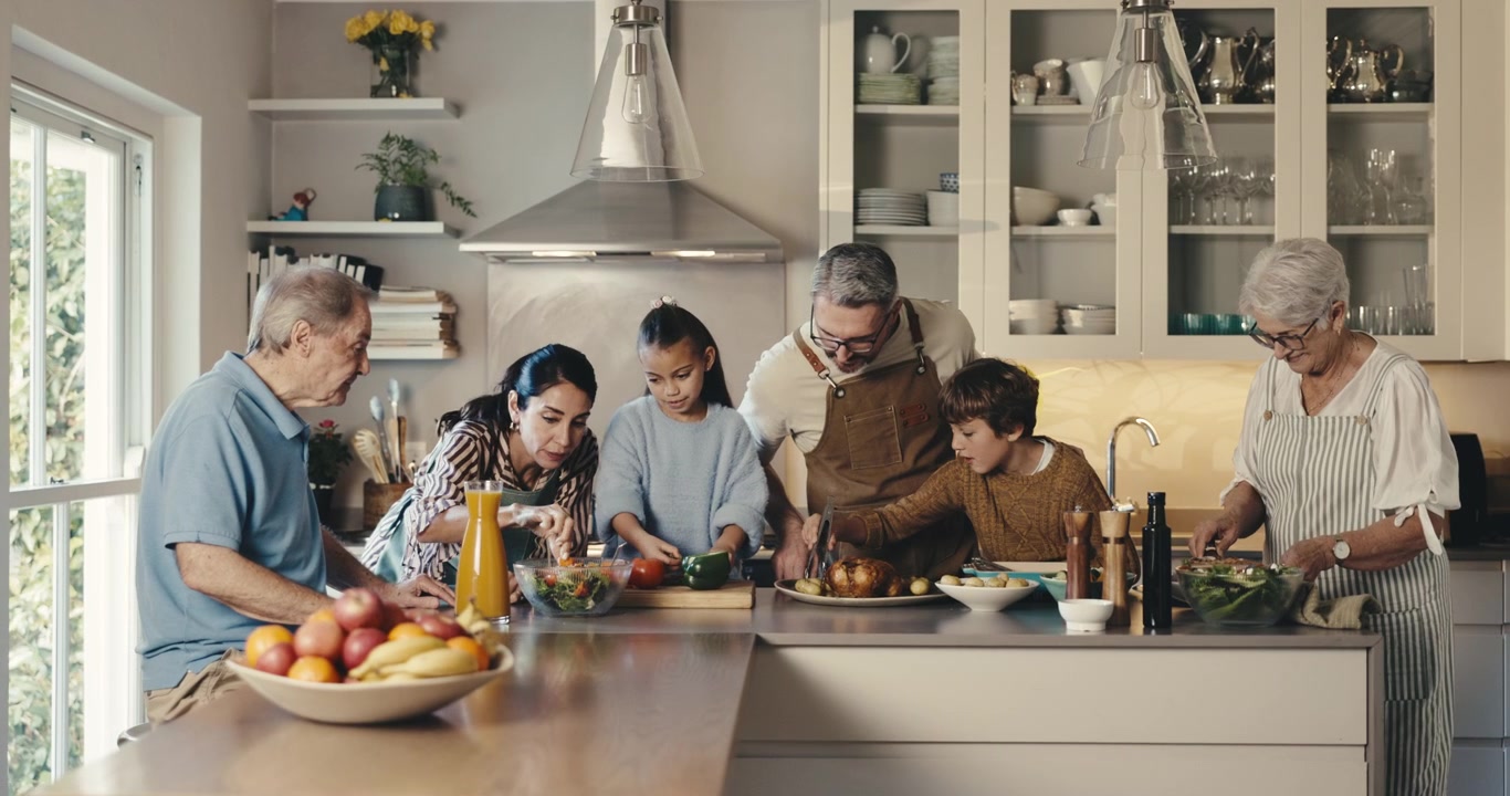 Multi-Generational Family Preparing a Healthy Meal Together in a Modern Kitchen