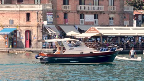 tourist boat passing by sorrento quay