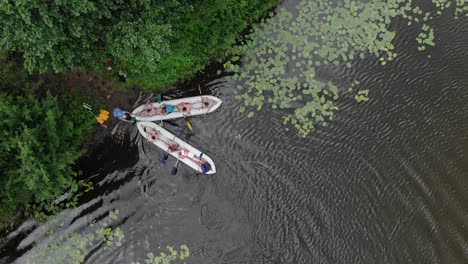 aerial drone top view shot of two dinghy boats racing in a lake