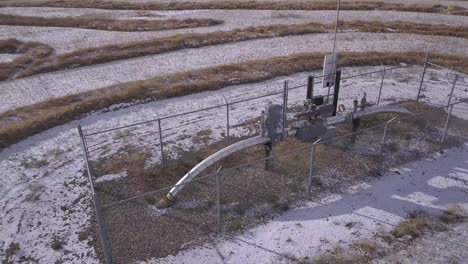 rotating view of natural gas pipeline monitor station in prairie field