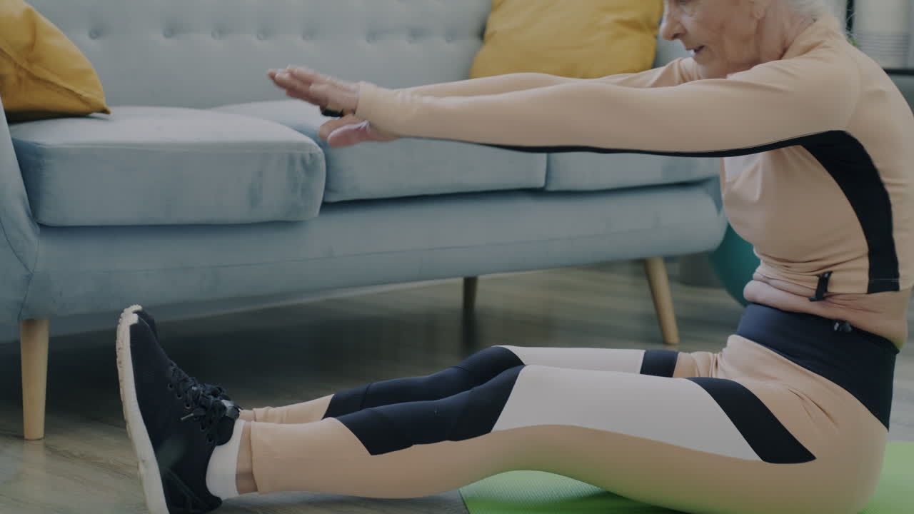 Elderly Woman Doing Stretching Exercises at Home