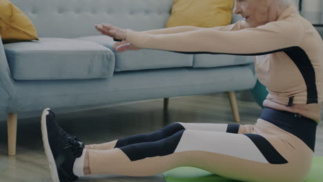 elderly woman doing stretching exercises at home