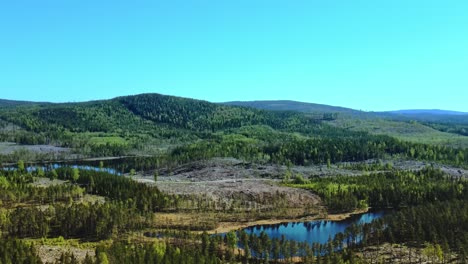 green mountain scenery near busjon lake in dalarna, sweden - aerial shot