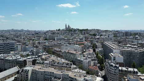 paris 17th district or 17ã¨me arrondissement with montmartre and sacre coeur or sacred heart basilica in background