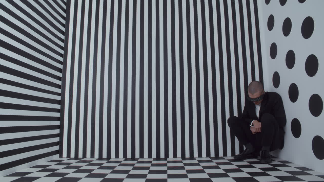 Man in VR headset in a black and white geometric room