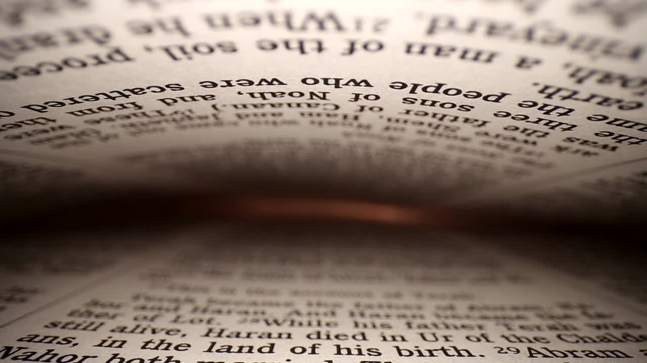Slowly pushing lens into a book at a words eye view of the pages, pages on both top - bottom of viewpoint