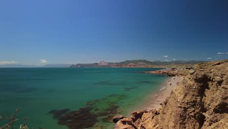 Crimea,-Cape-Megan,-surfers-with-a-sail-cut-through-the-green-water-of-the-Black-Sea-in-spring-4k