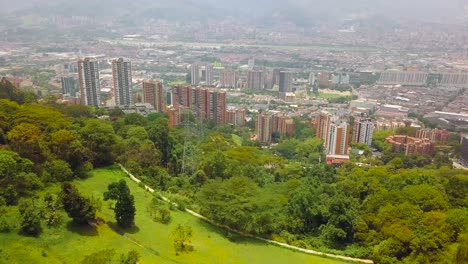 Ascending-shot-revealing-Medellin-city-center-from-Mirador-de-las-Palmas,-Castropol-Colombia