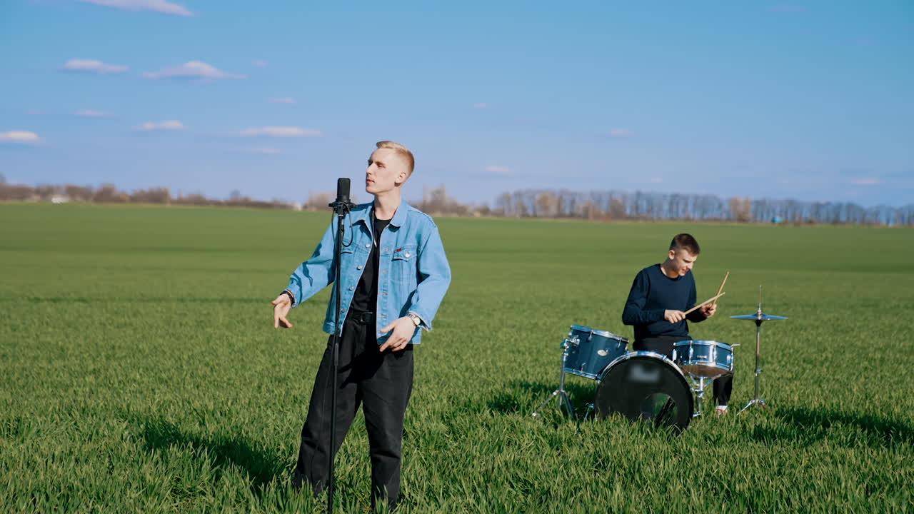 Music band performing on field. Musicians performing outdoors, playing music on field