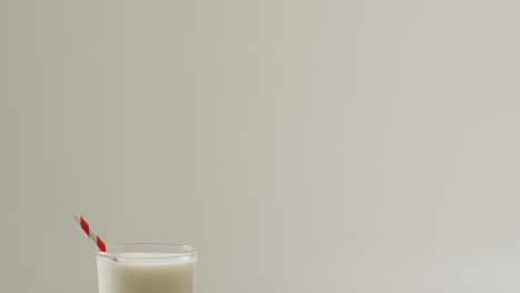 video of glass of fresh milk on white background