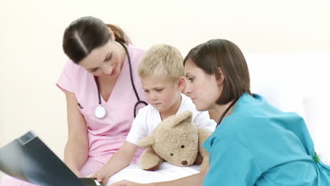 nurse and doctor with a little boy
