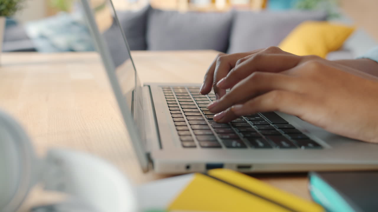 Person Typing on Laptop
