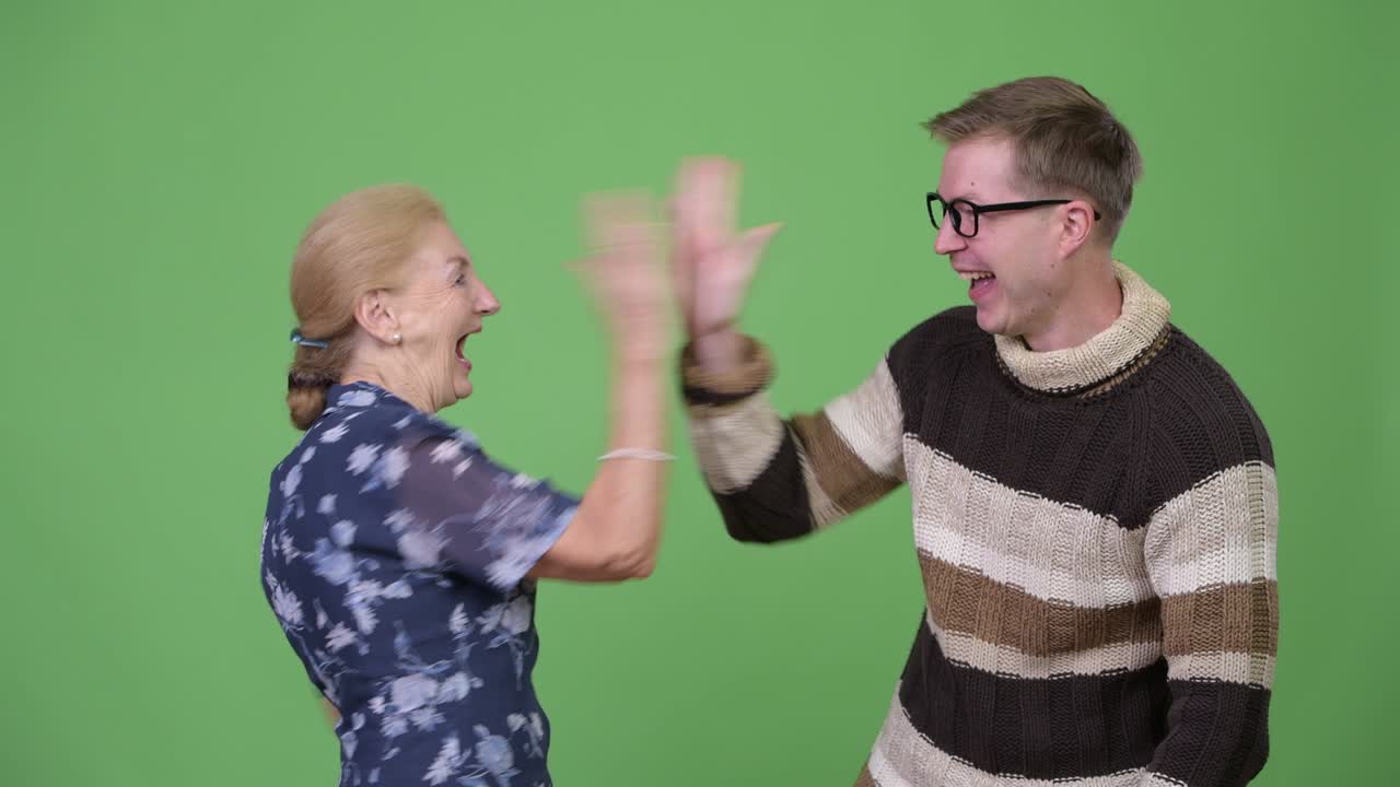 Happy grandmother and grandson looking excited together