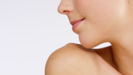 close-up of a woman's face and shoulders