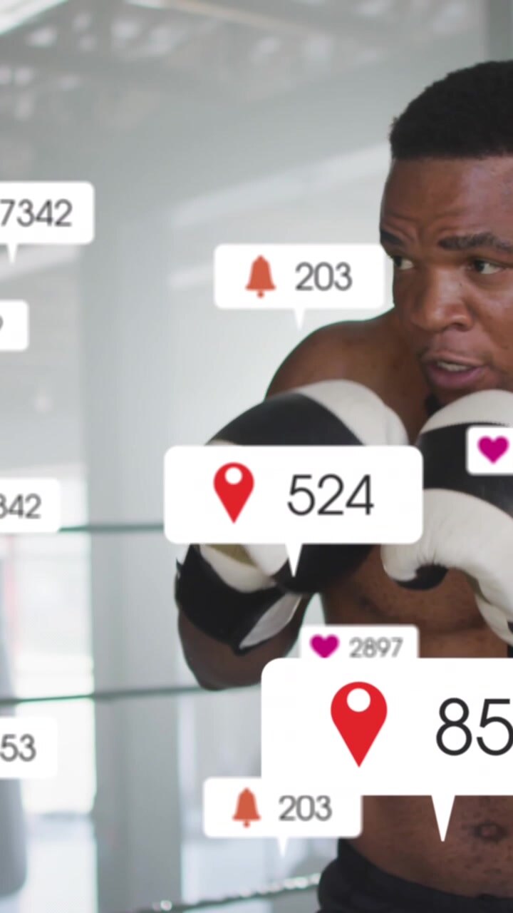 Animation af notifikationsbjælker over afroamerikansk bokser, der øver slag i ringen.