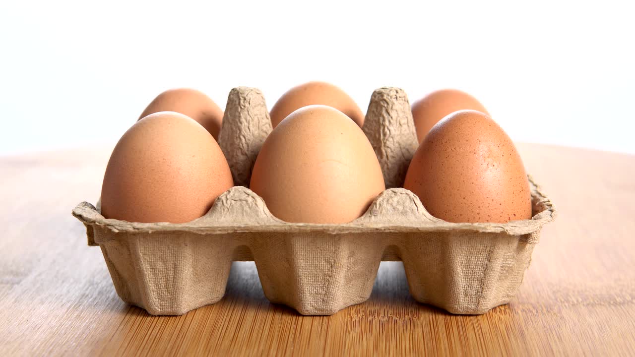 3 angle of six eggs disappear one by on on egg paper tray