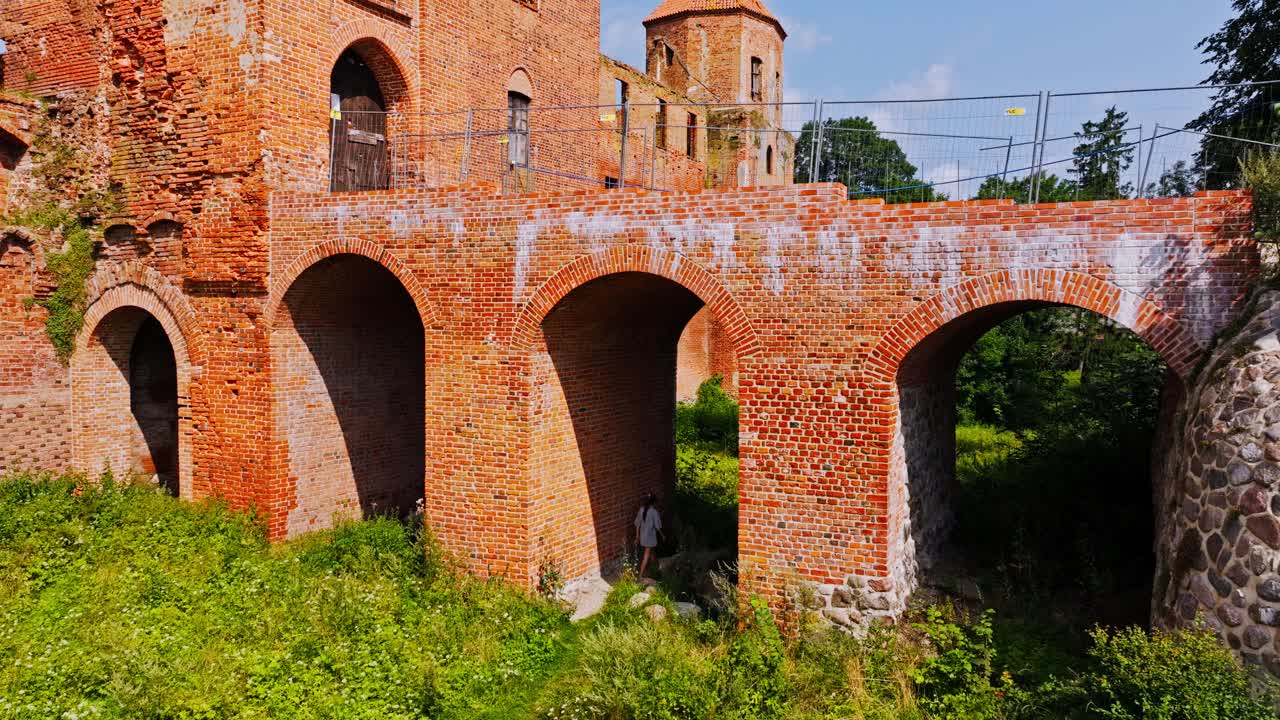 Ancient red brick fortress ruins symbolize timeless human struggles for power