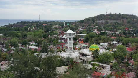 aerial of white mosque tower on local gili trawangan island around bali indonesia