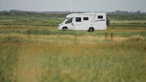 a motorhome driving through the fields