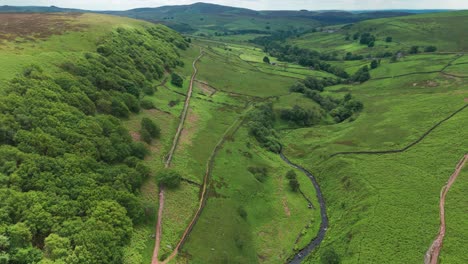 High-angle-drone-shot-capturing-beauty-of-three-shire-heads-and-green-fields-of-Dane-Valley-in-Derbyshire,-England