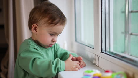 baby by the window