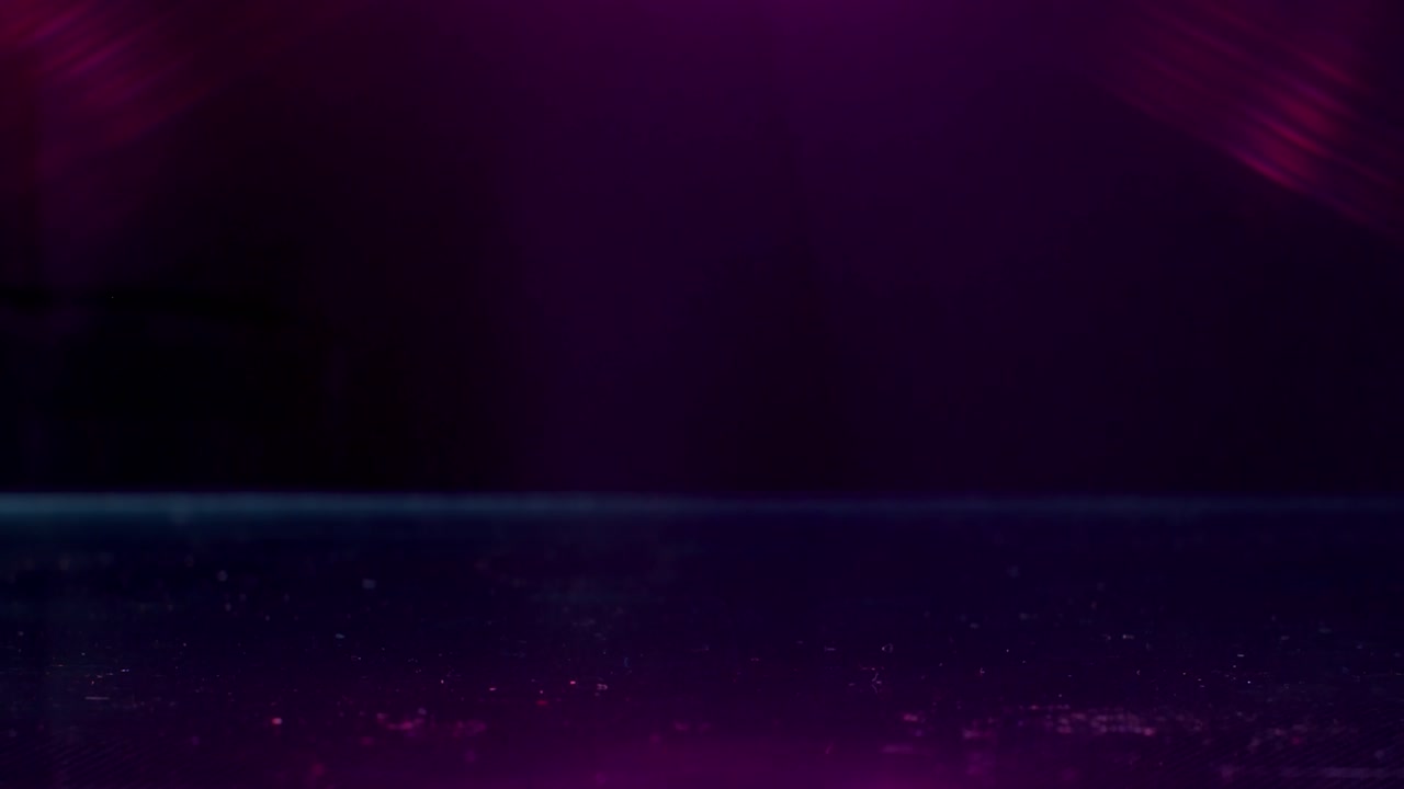 mármol golpeado por otro mármol en una superficie reflectante bajo luces de colores en cámara lenta