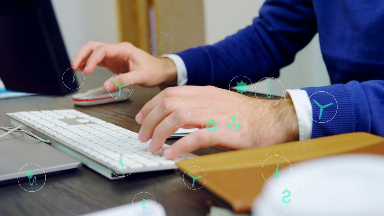 Impiegato che digita e clicca su tastiera e mouse, visualizzando icone finanziarie sulle mani