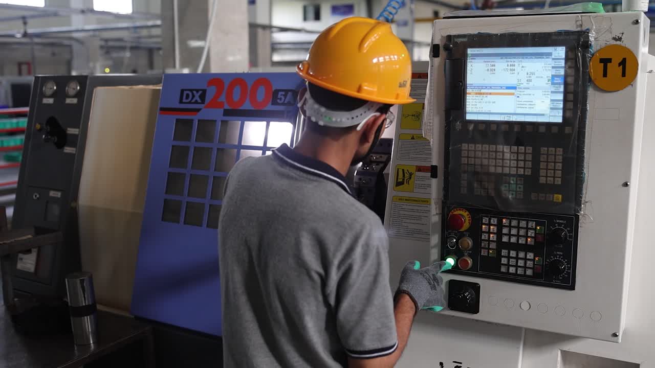 workers’ high precision valve part making A CNC machine. Industry 5.0, industrial 4.0 concept