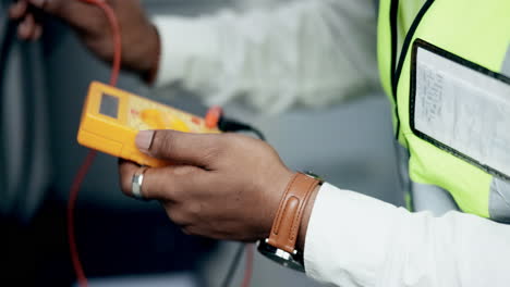 technician, hands and multimeter testing power
