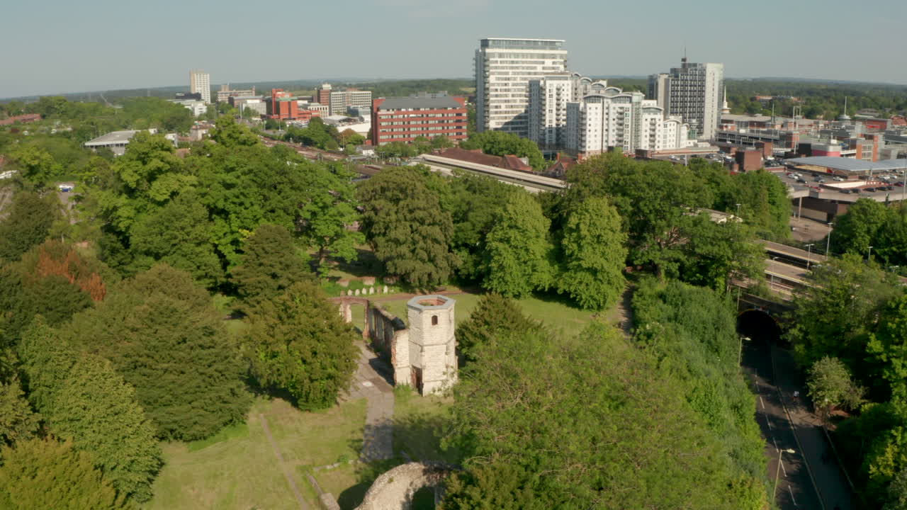 Circling aerial shot of the Holy Ghost Cemetery with Basingstoke in the background