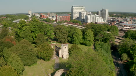 Circling-aerial-shot-of-the-Holy-Ghost-Cemetery-with-Basingstoke-in-the-background