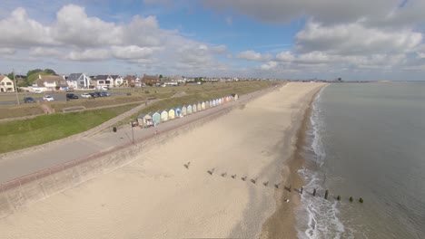 Aerial-Drone-Footage-of-the-Beautiful-Beach-Huts-on-the-coast-of-Gorleston-On-Sea,-Norfolk