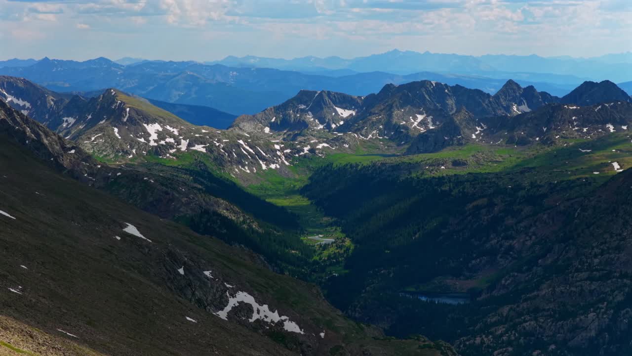 Elk Mountains range Maroon Bells Capitol Peak Mount Snowmass Castle Conundrum Peak spring summer Colorado aerial drone Rocky Mountains valley Sawatch Range Mount of the Holy Cross 14er circle left