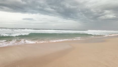 koggala beach tropical sandy shore indian ocean stormy water tide cloudy skyline